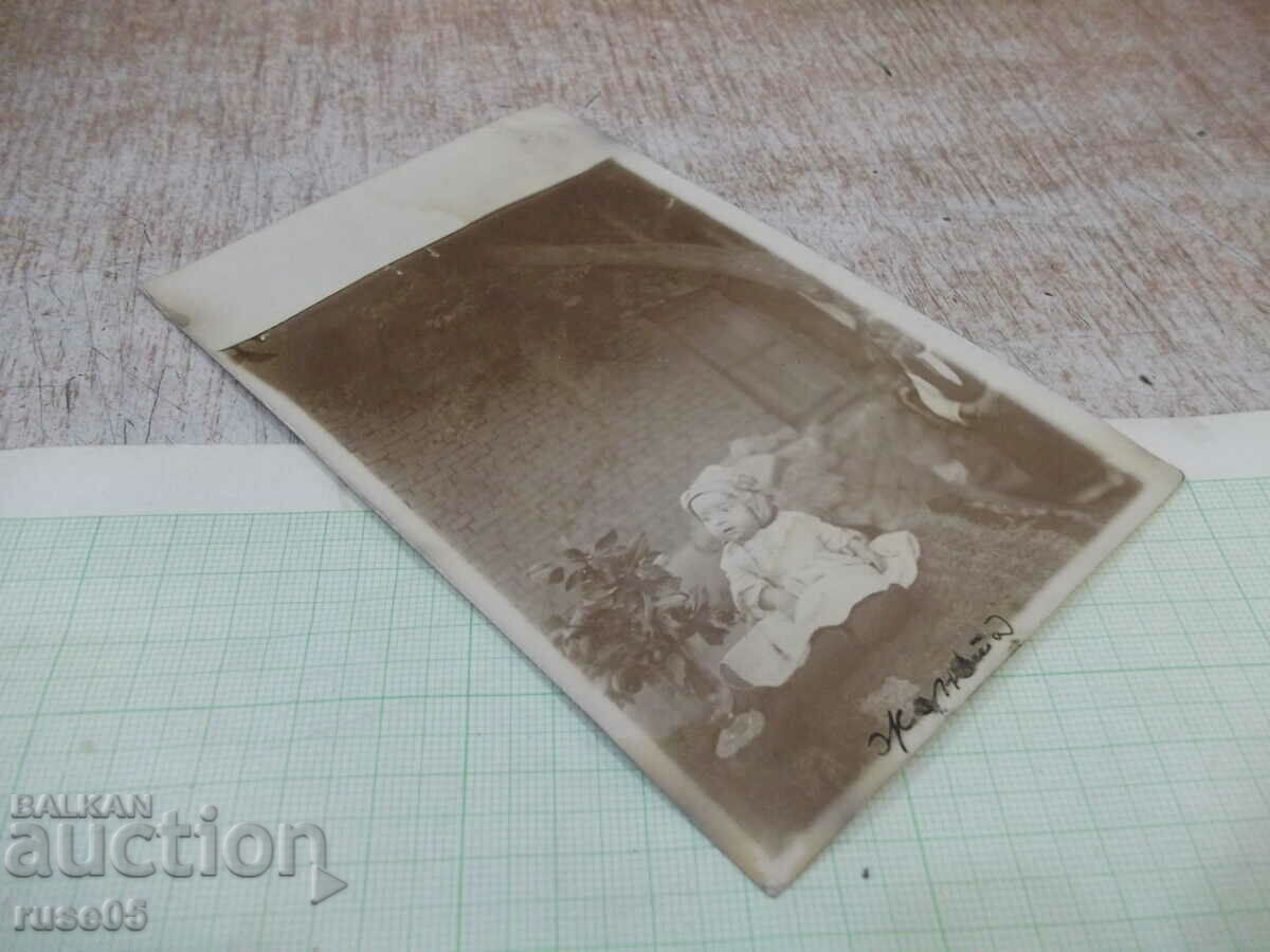 Auction Old photo of a small child in front of a house Auction Old photo of a small child in front of a house