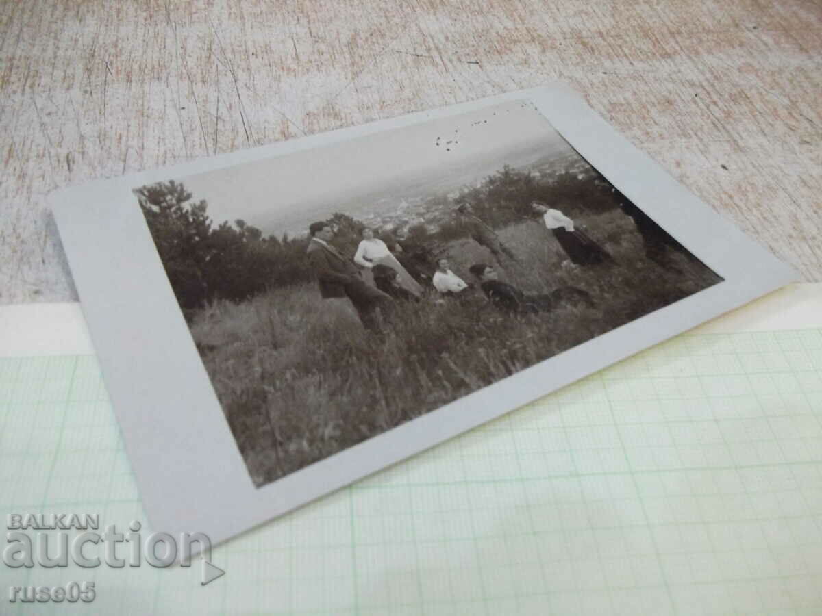 Auction Old photo of a group of young people over the city Auction Old photo of a group of young people over the city