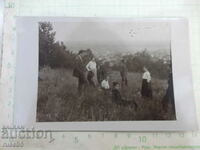 Old photo of a group of young people over the city