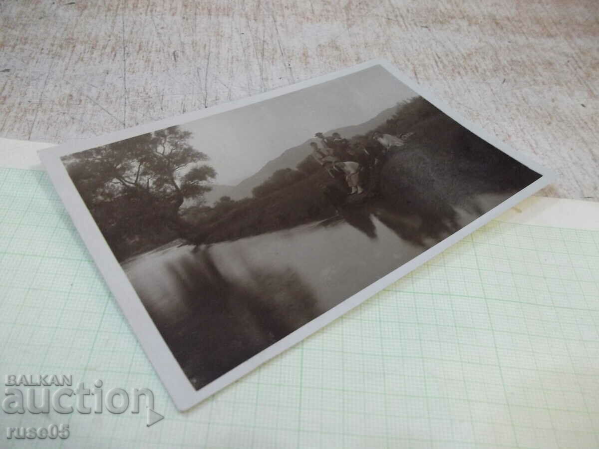Auction An old photo of a group of young people sitting on the bank by the river Auction An old photo of a group of young people sitting on the bank by the river