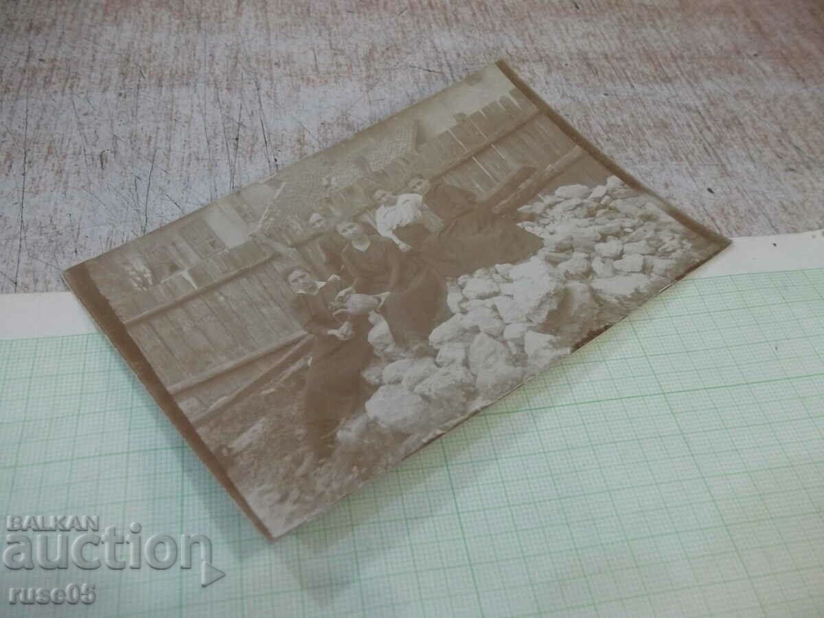 Auction  Old photo in front of the fence with a pitcher