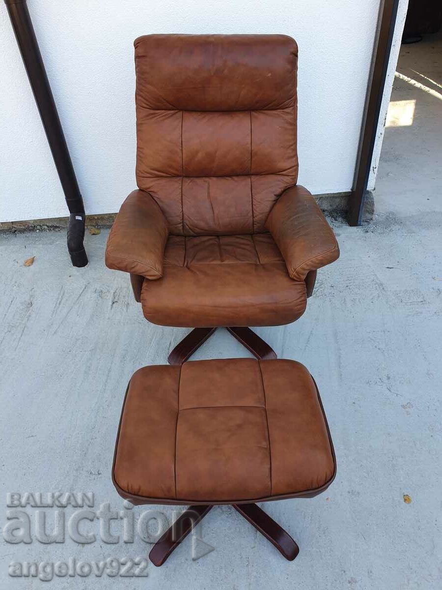 Beautiful solid leather swivel chair with sleep option!