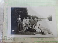 Old photo of a group by the river