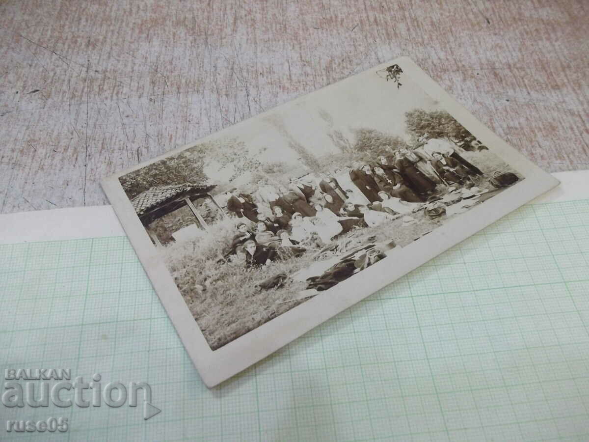 Delivery of Old photo of a group of young people on an outing with a priest - 1