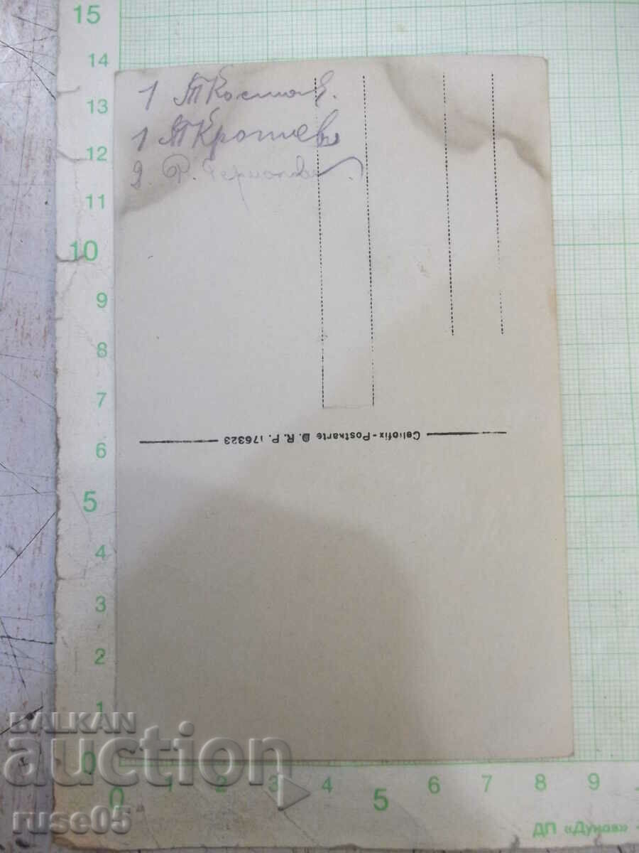 Auction  An old photo of a group of young people by the river bridge