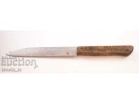 Antique knife with a wooden handle