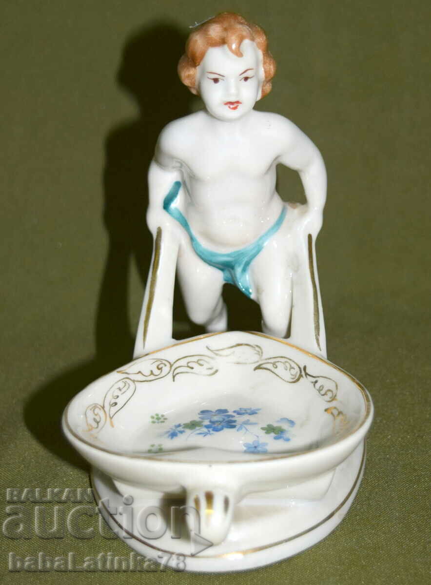 An interesting old porcelain figurine