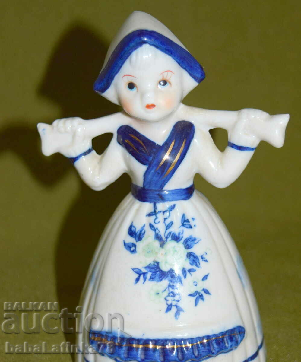 A beautiful little porcelain figurine of a girl