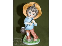 Interesting porcelain figurine of a boy