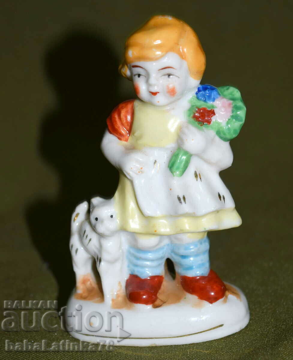 Interesting porcelain figurine of a girl and a kitten