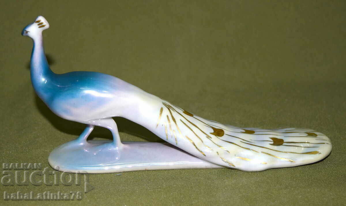 An interesting hand-painted porcelain peacock figurine