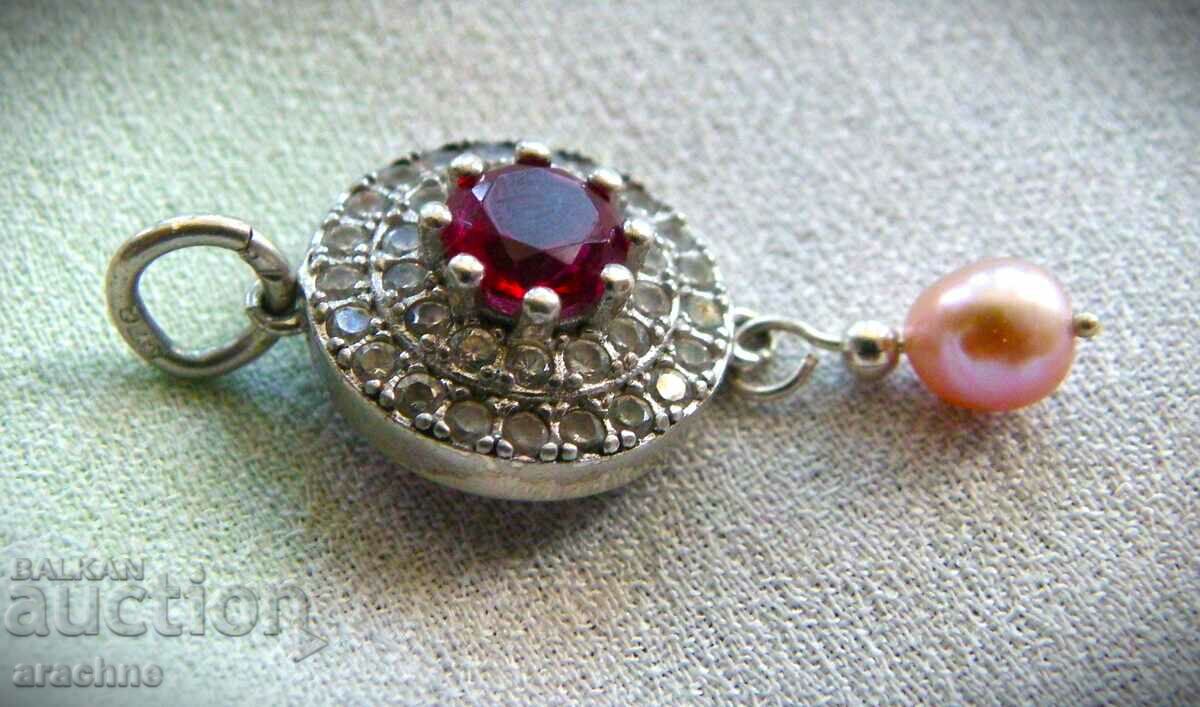 Silver locket with ruby and pink pearl with price 120.00 BGN | € 61.36 Silver locket with ruby and pink pearl with price 120.00 BGN | € 61.36