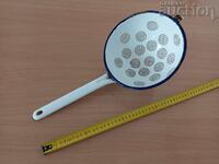 Old enamel colander, enamel dish