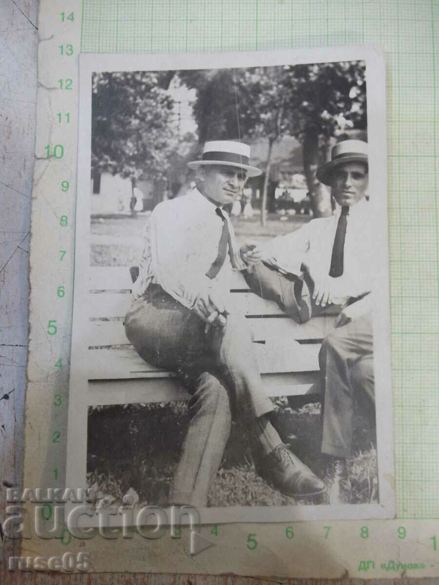 Old photo of two men on a bench