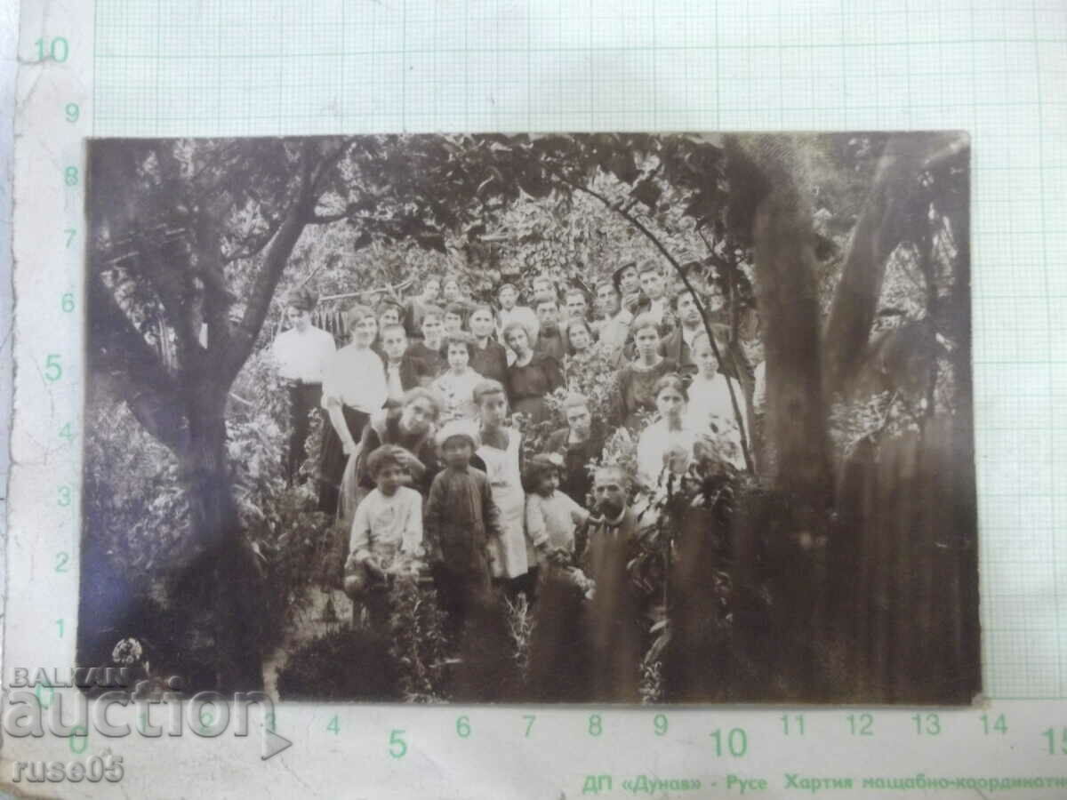 Old photo of young people in the garden