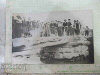 Old photo of young people on the bridge over the river