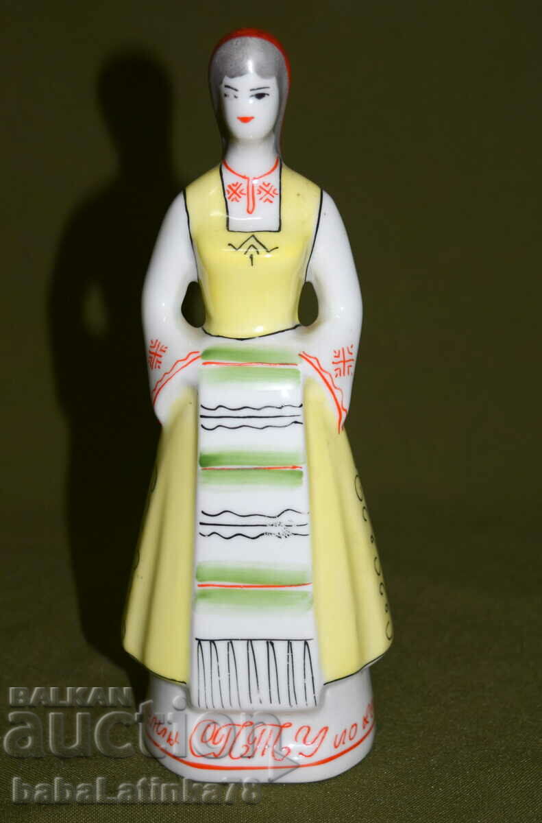 An interesting hand-painted porcelain figurine