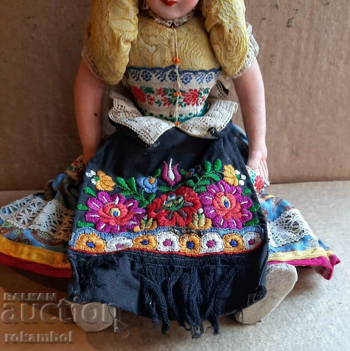 Delivery of Hungarian folk doll in traditional clothing Delivery of Hungarian folk doll in traditional clothing