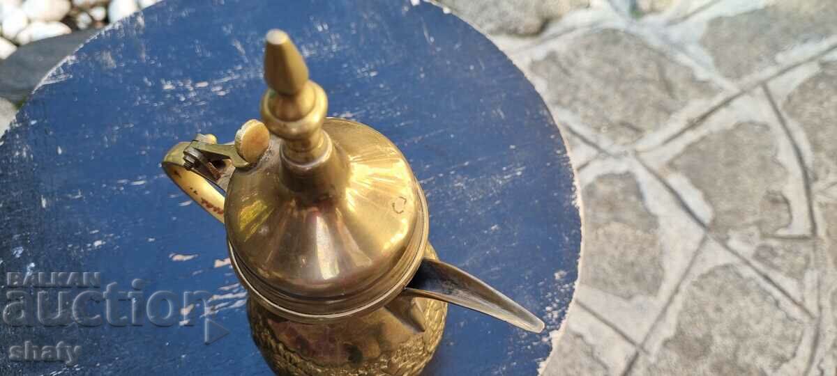 Delivery of Old bronze jug. Arab teapot Delivery of Old bronze jug. Arab teapot