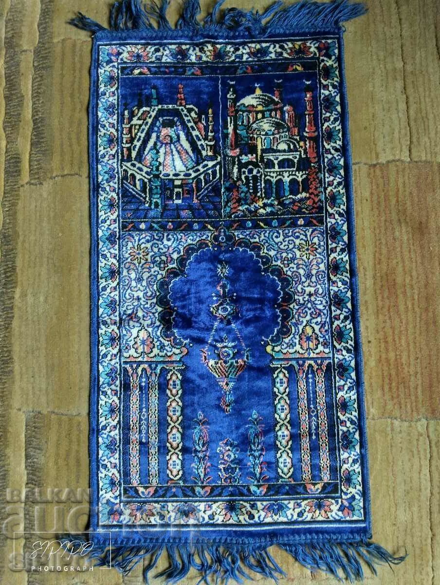 A prayer rug purchased from Mecca.