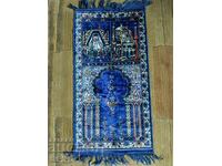 A prayer rug purchased from Mecca.