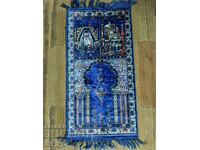 A prayer rug purchased from Mecca.