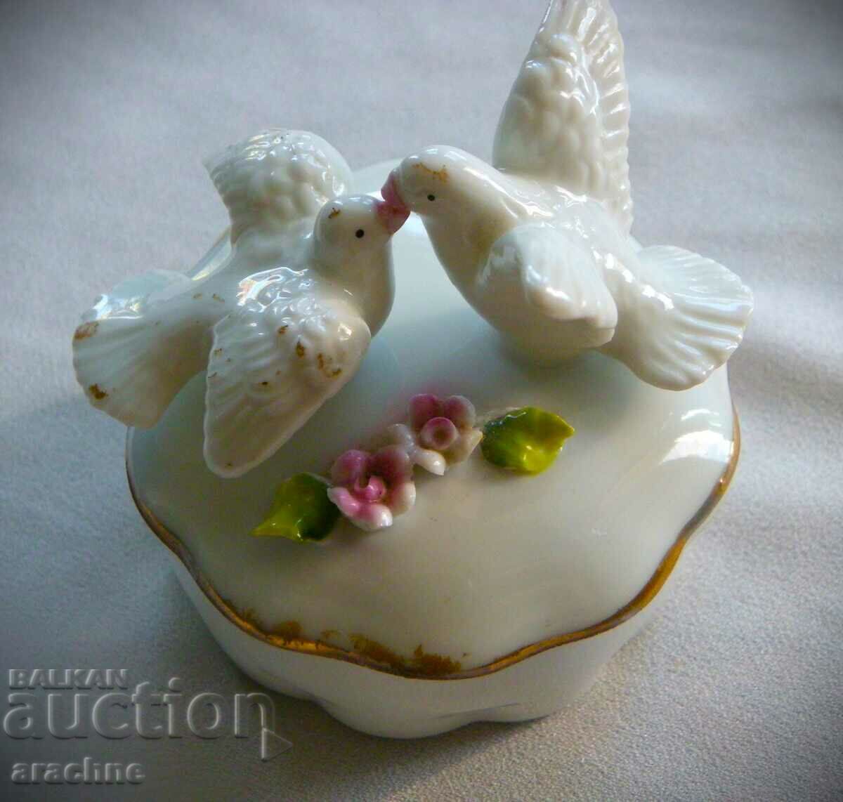 A very old porcelain jewelry box