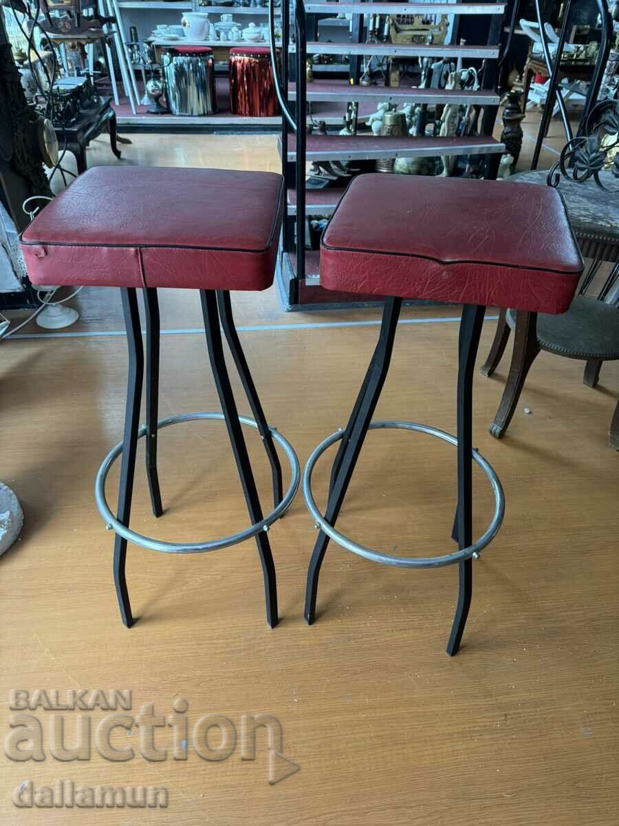 Pair of bar stools with leather seat and metal legs