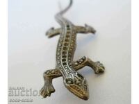 Old lady's silver brooch with gold pin jewel lizard