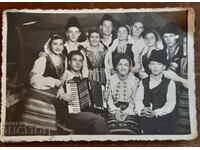 Old photo of a cast in costume