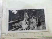 An old photo of three Bulgarian women in the orchard in America