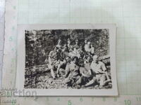 Old photo of a group in the woods in America