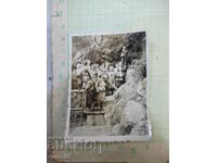 An old photo of a group of elderly women on an outing by the rocks