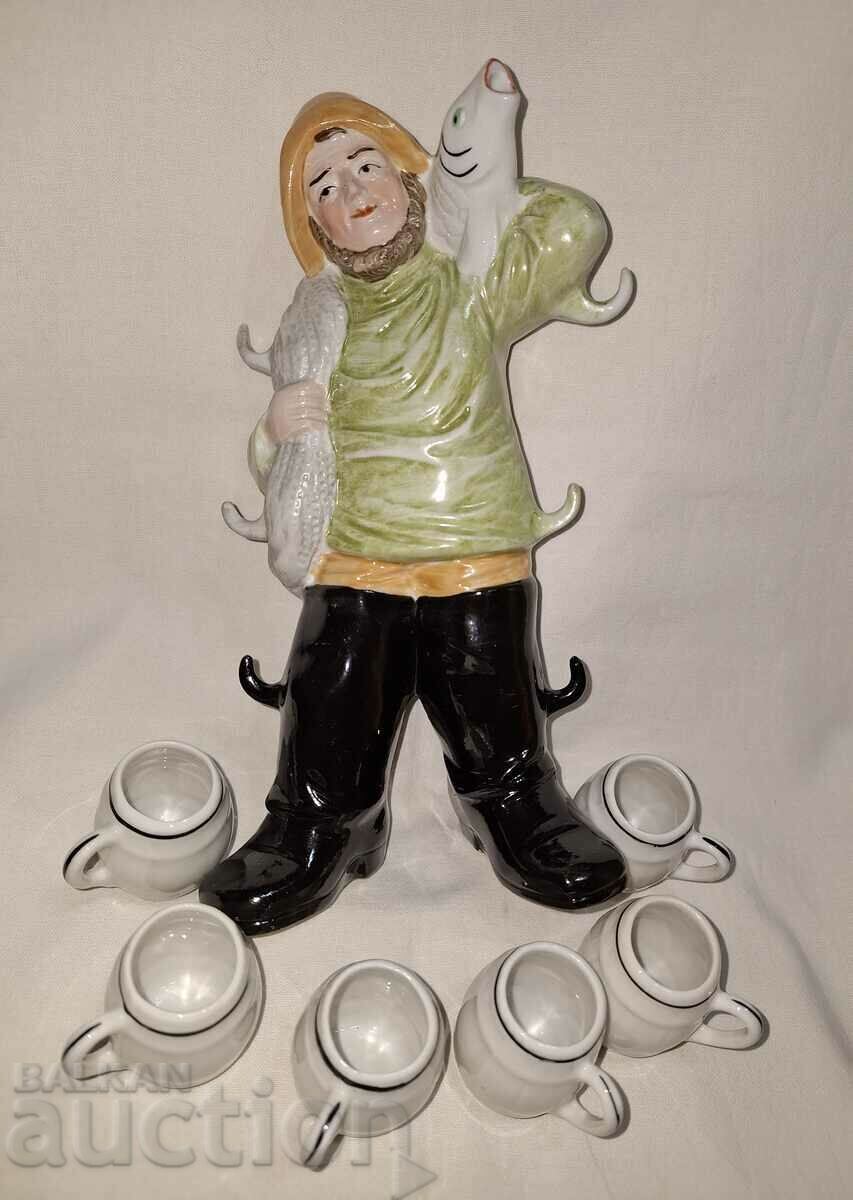 Porcelain jug figure fisherman with cups with price 70.00 BGN | € 35.79 Porcelain jug figure fisherman with cups with price 70.00 BGN | € 35.79