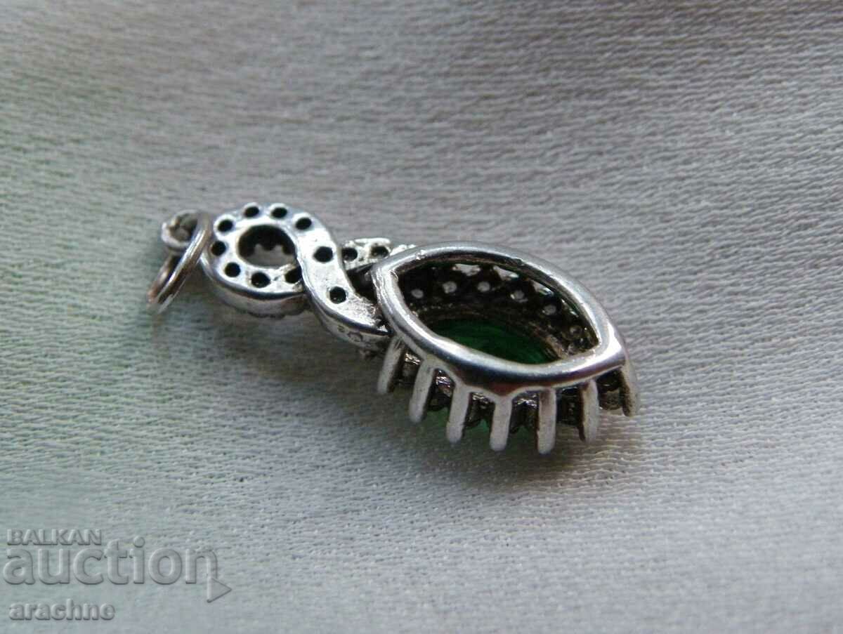 Auction Silver medallion with verdelite and topaz Auction Silver medallion with verdelite and topaz