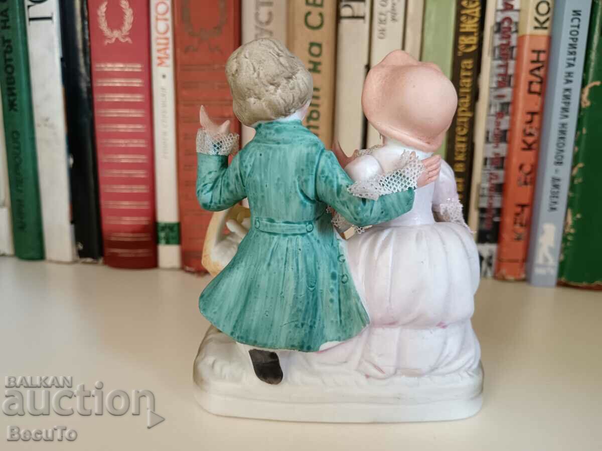 Auction Porcelain figurine girl and boy with basket, lace Auction Porcelain figurine girl and boy with basket, lace