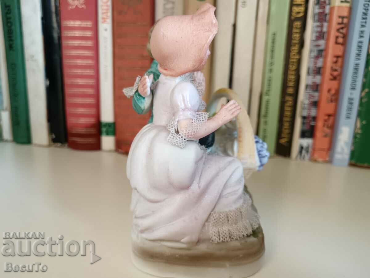 Delivery of Porcelain figurine girl and boy with basket, lace Delivery of Porcelain figurine girl and boy with basket, lace