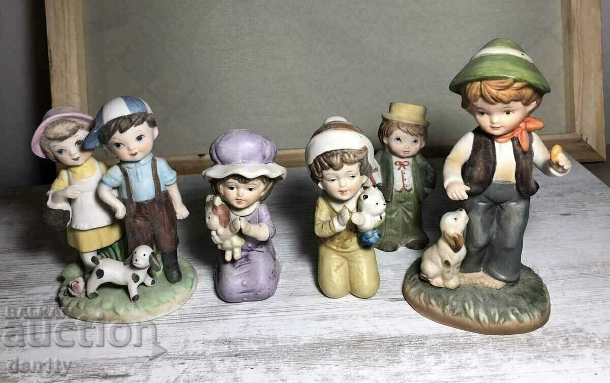 ceramic statues of children in hummel style