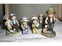 ceramic statues of children in hummel style