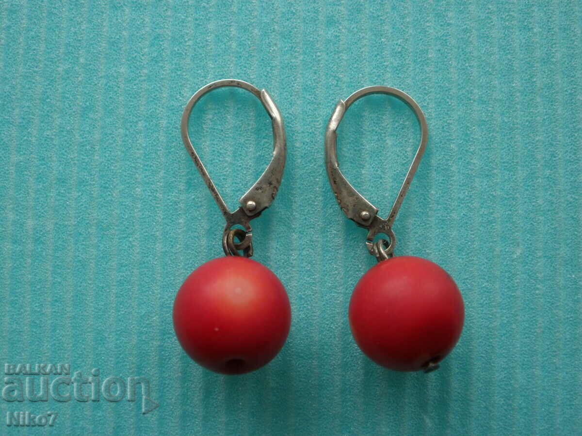 Old silver earrings with coral.