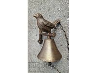 Cast iron bell with a chicken.