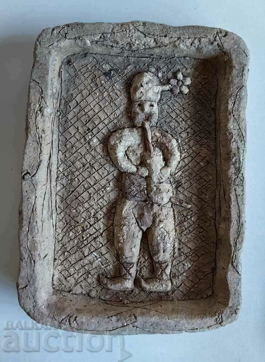 . AN OLD CERAMIC PANEL OF A BASICIAN IN COSTUME . AN OLD CERAMIC PANEL OF A BASICIAN IN COSTUME