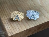 Two collectible Olympic badges