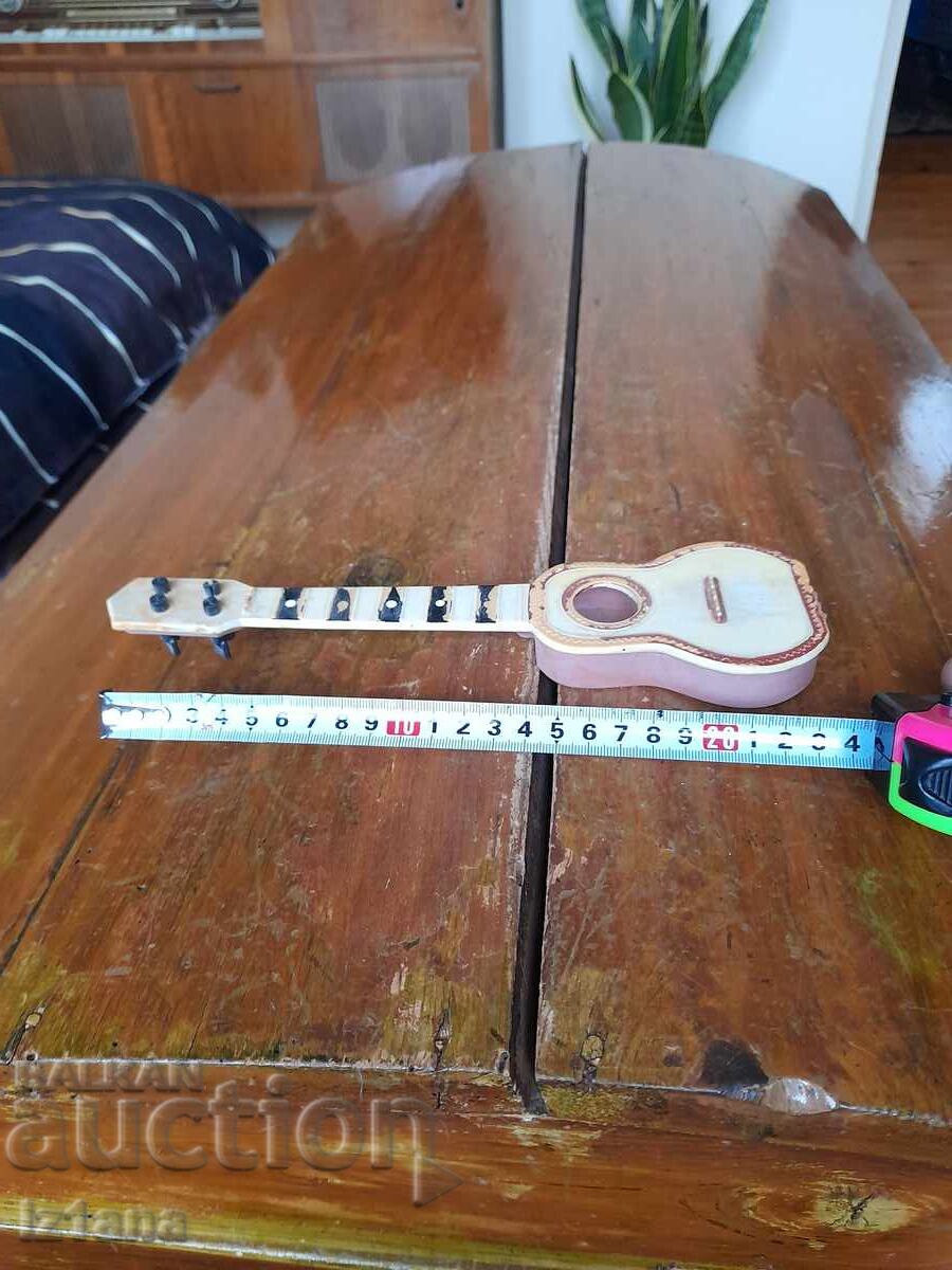 Old children's guitar with price 10.00 BGN | € 5.11 Old children's guitar with price 10.00 BGN | € 5.11