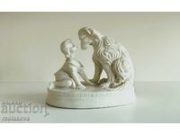 Alabaster figure of a child and a dog