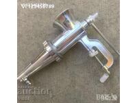 Manual meat grinder with metal tomato attachment