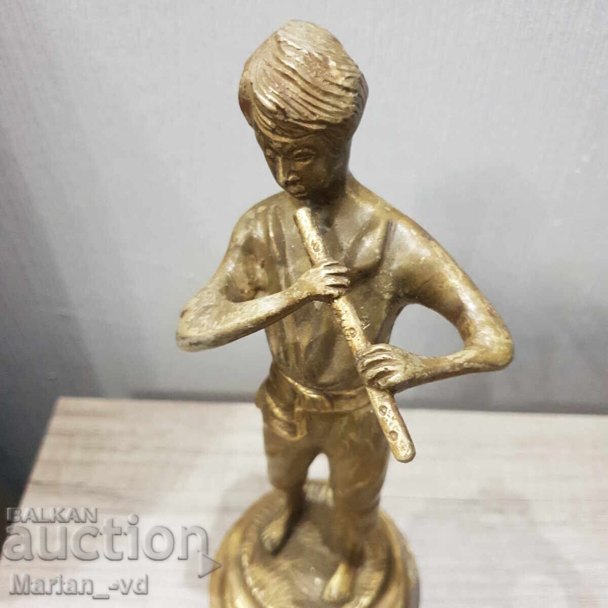 Auction Old brass figure of a boy playing the flute Auction Old brass figure of a boy playing the flute