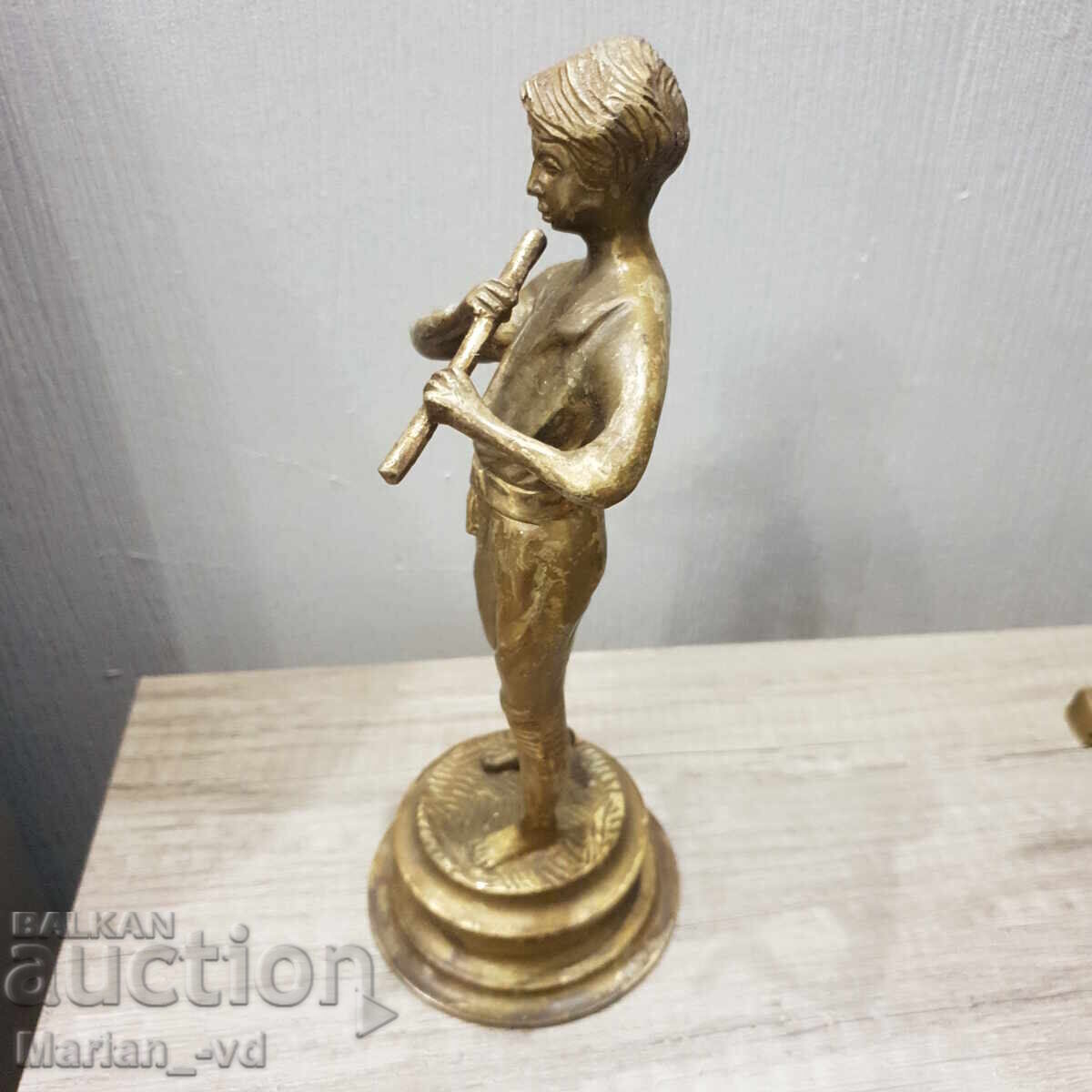 Delivery of Old brass figure of a boy playing the flute Delivery of Old brass figure of a boy playing the flute