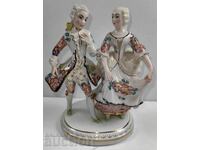 . PORCELAIN FIGURINE MAN WOMAN MARKED HEALTHY