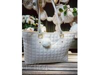 Women's leather bag with a white puff